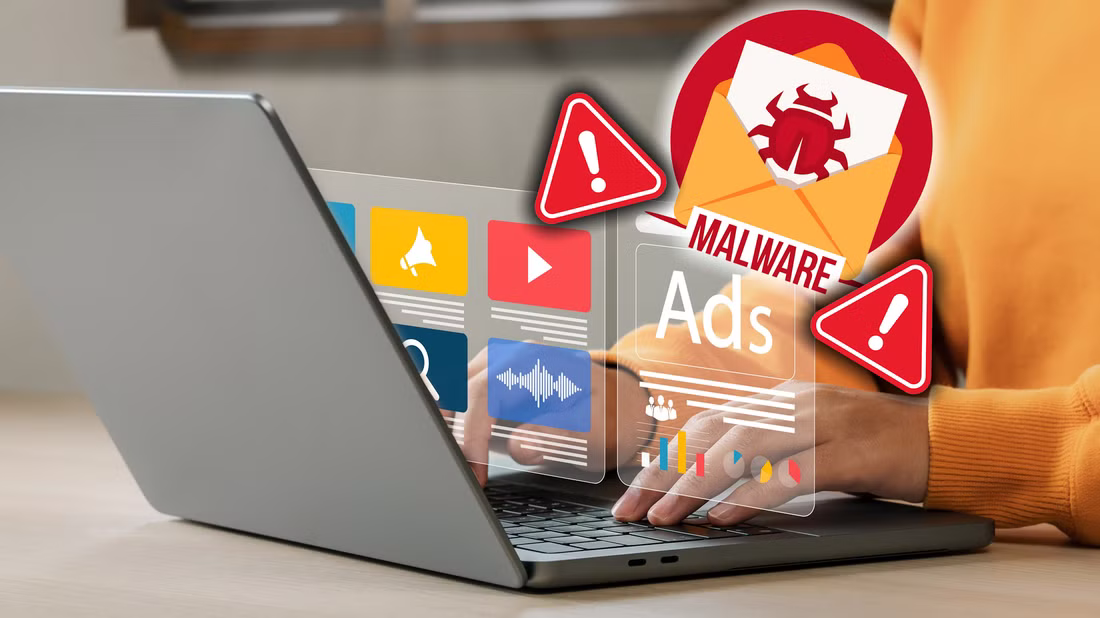 person browsing internet on laptop with malware sign